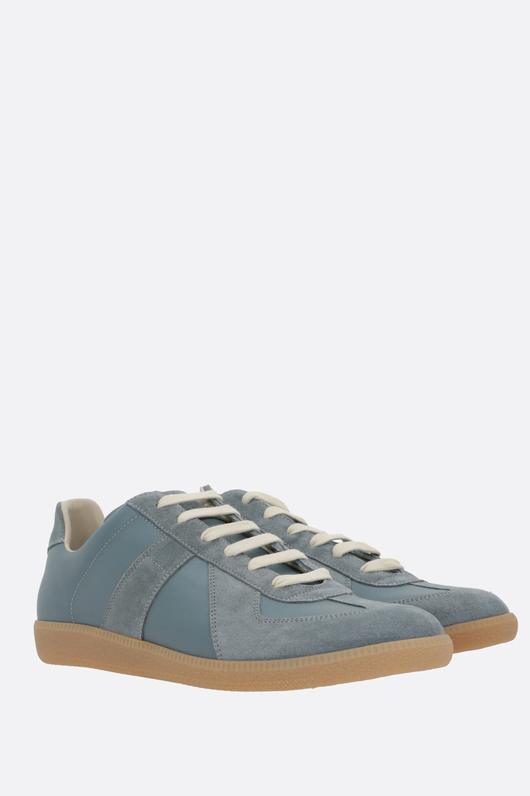 Replica sneakers in leather and suede